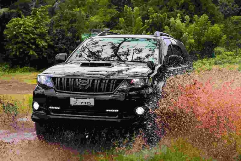 A suv crossing the stream in forest-car rental kashmir
